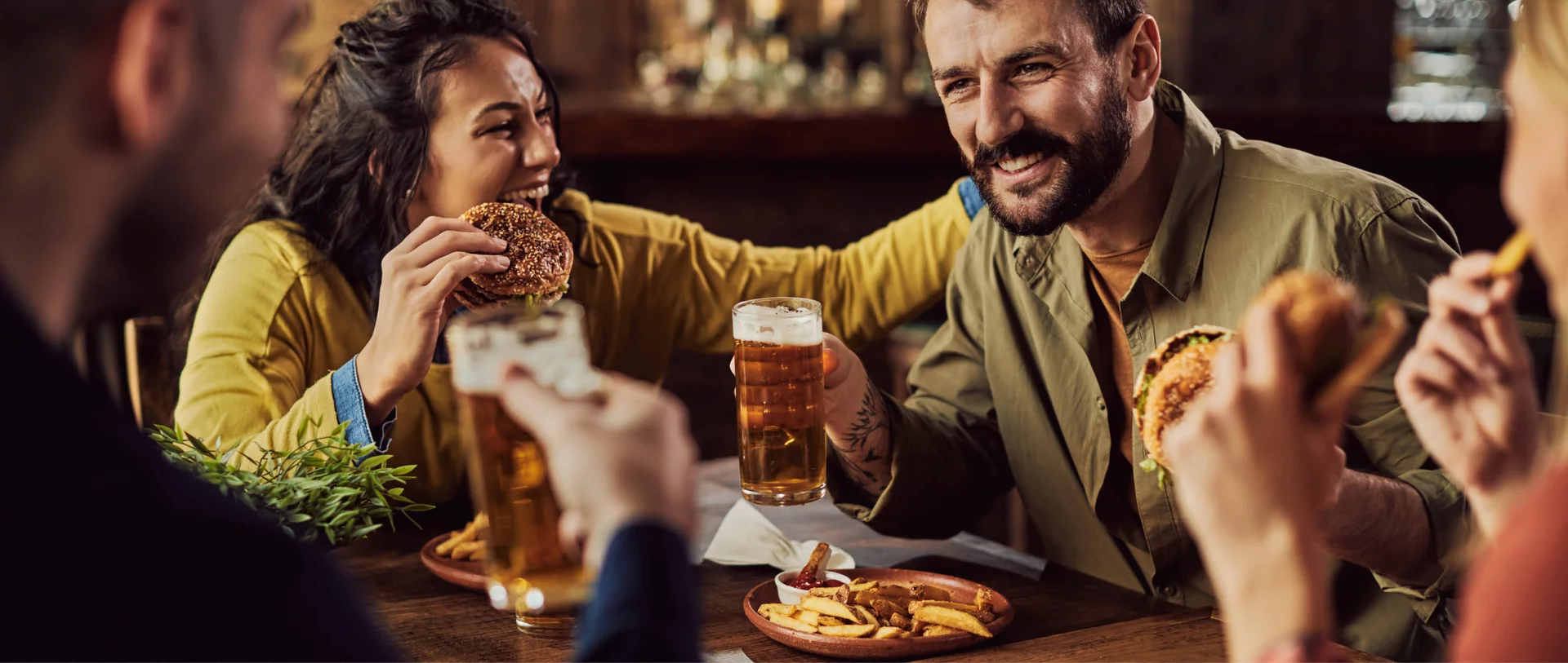 People eating and chatting around a table