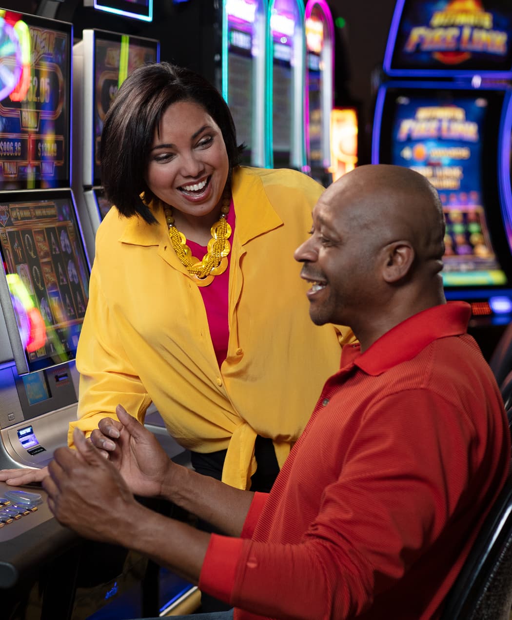 Guests hitting a win on a slot machine