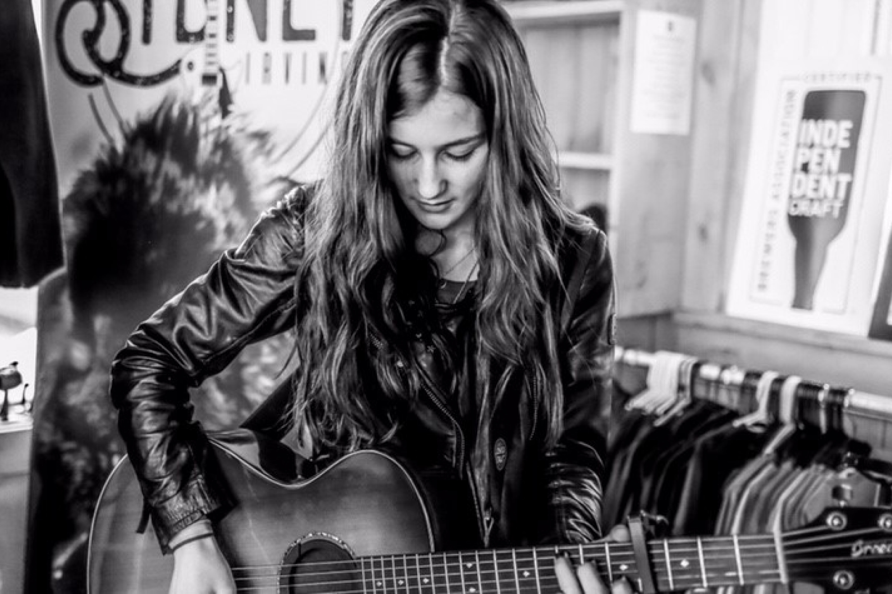 sydney irving playing guitar black and white